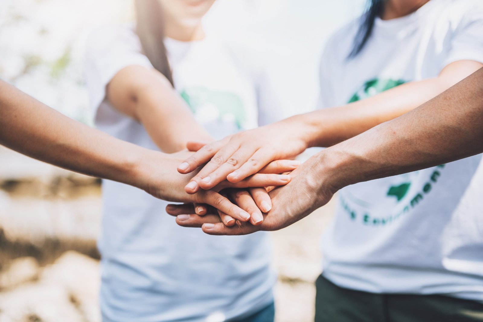 close up people volunteer teamwork putting finger star shapehands togetherstack handsunity teamwork world environment day 1 scaled